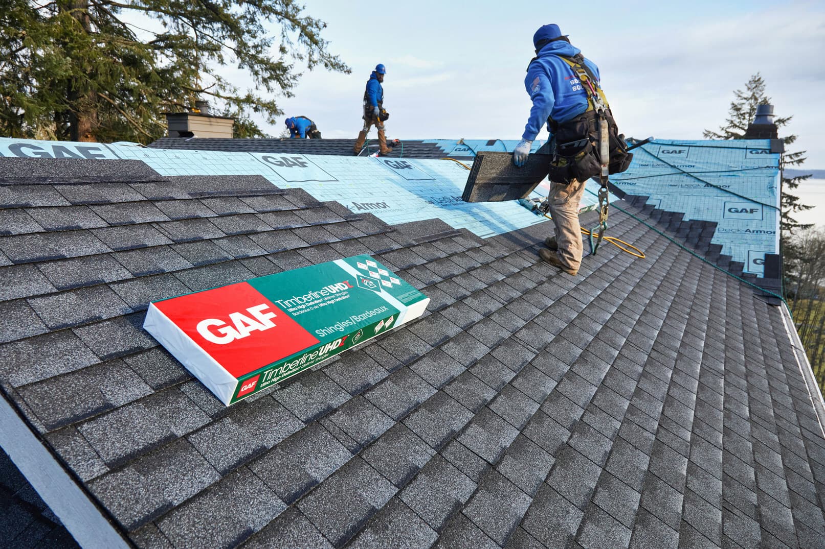 Texas Premier Contractors crew installing GAF Timberline architectural shingles on a residential Houston roof